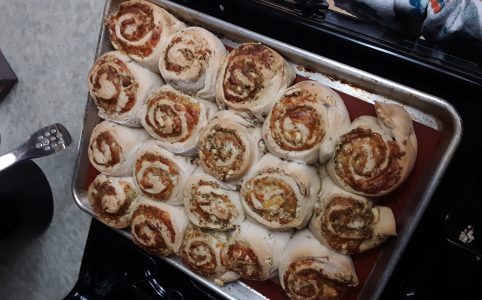a sheet pan of freshly baked rolls