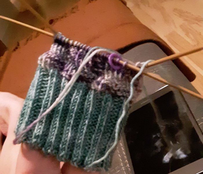 the cuff and first few rows of a sock, on the needles