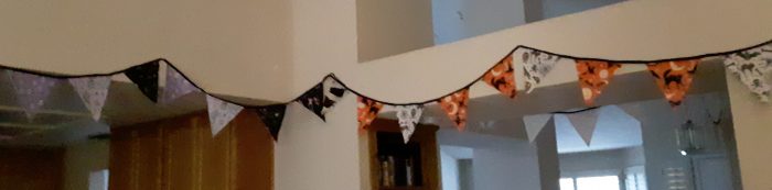 halloween bunting strung across my living room wall