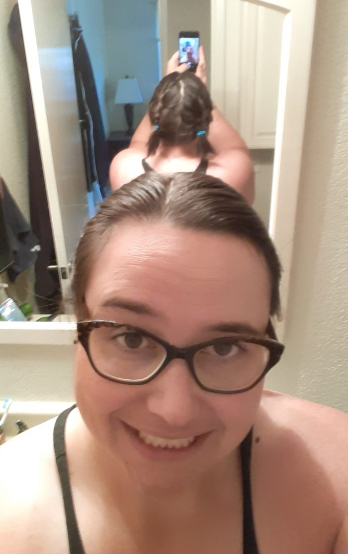 me with my back facing the mirror. photo shows top of my head and behind to get the view of the braids