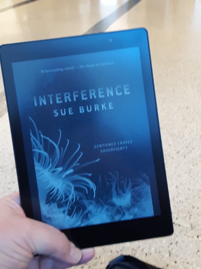 cover of "Interference" by Sue Burke on Kobo, taken in an airport