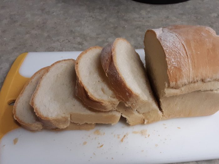 a loaf of white bread, sliced
