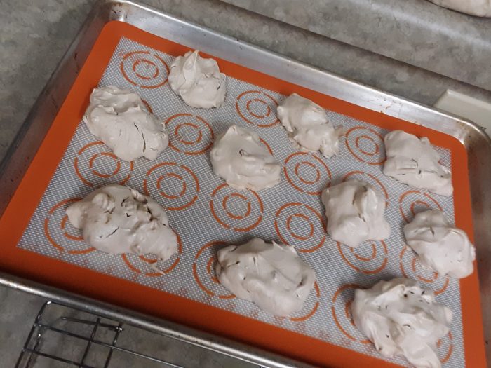 a sheet pan of merengue cookies