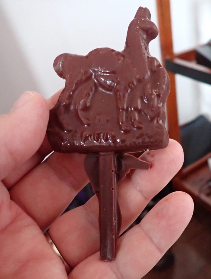 a piece of chocolate molded in the shape of a llama