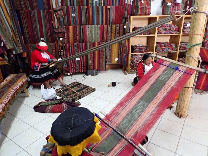 indigenous women weaving at the textile museum