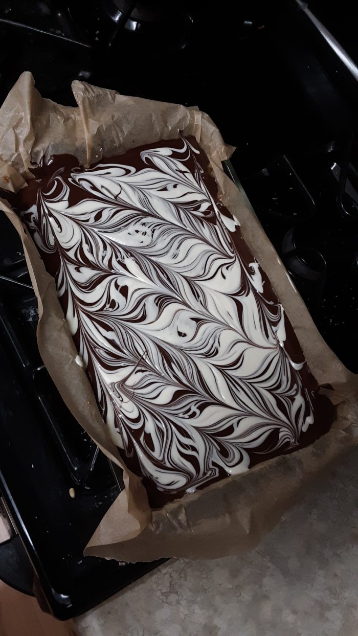 view of the top of millionaires shortbread: chocolate with white chocolate swirled on top