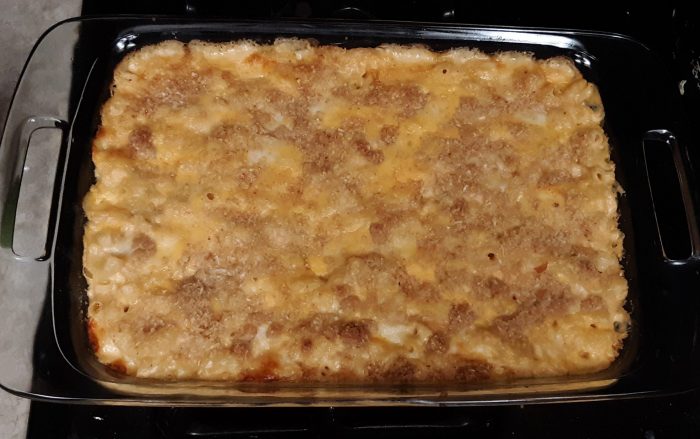 a casserole pan full of baked macaroni and cheese