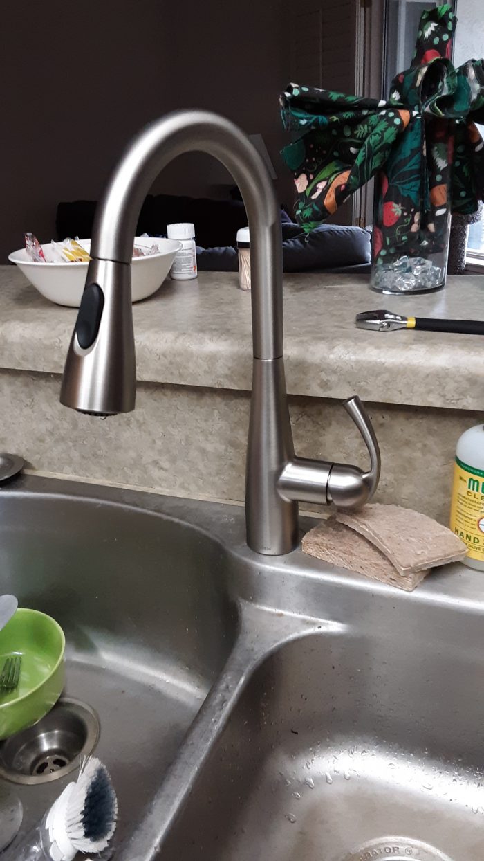 newly installed stainless steel faucet