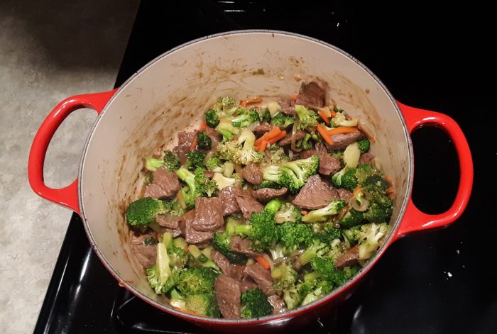 beef and broccoli in the dutch oven pot