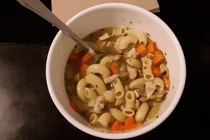 a bowl of chicken noodle soup