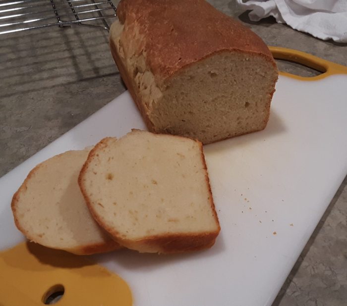 a loaf of bread with two slices cut to show the inside