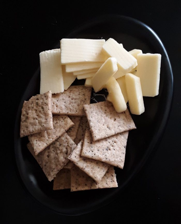 a tiny plate of cheese and homemade crackers