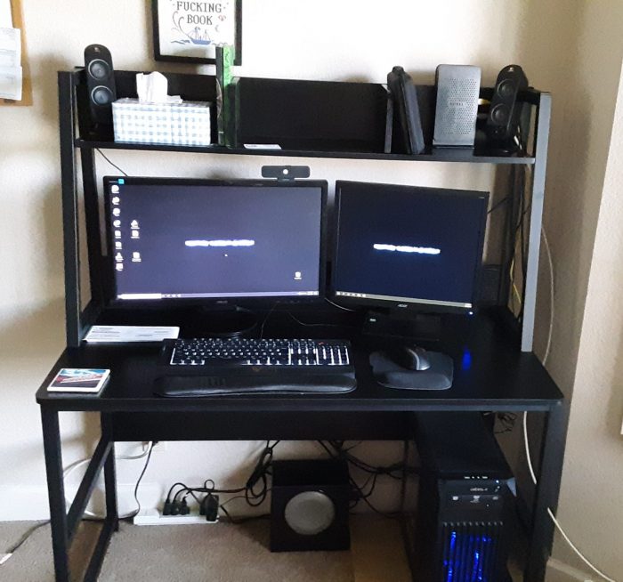 a picture of my new desk: black wood with a hutch above