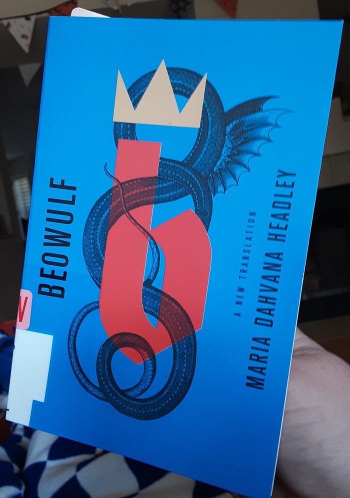 book cover of Beowulf, blue with a stylized serpent