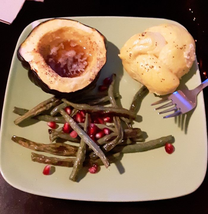 roast acorn squash, green beans with pomegranate seeds and pumpkin knots