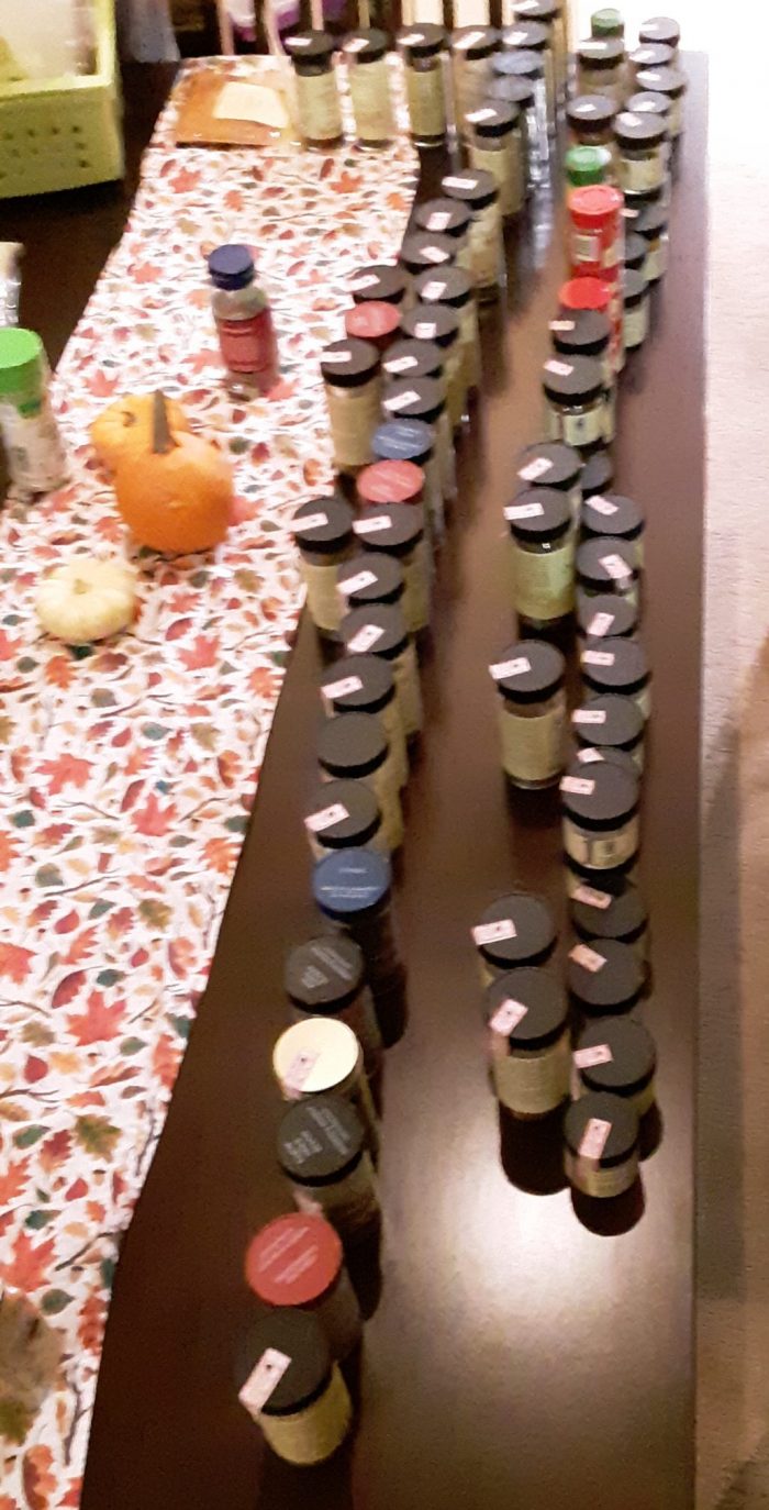 a ridiclous amount of spice jars lined up on our dining table