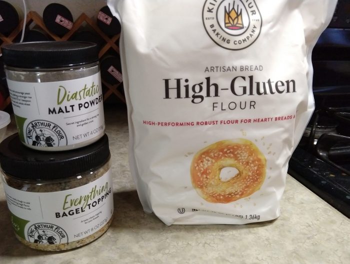 a bag of high-gluten flour and small jars of malt powder and "everything bagel topping" on my kitchen counter