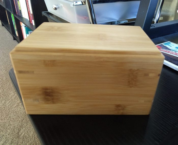 a small wood box containing the ashes of the late Viola the cat