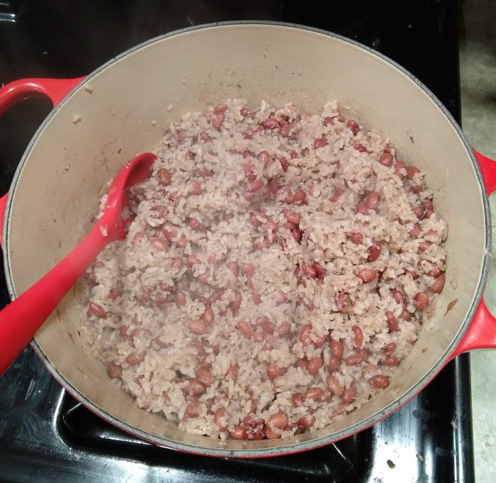 a large pot of red beans and rice sitting on the stove