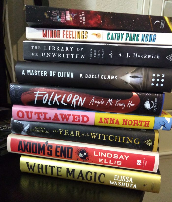 a stack of nine new books