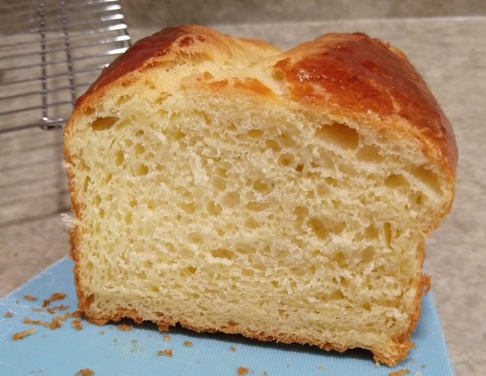 cross-section of the briche loaf revealing a buttery yellow interior