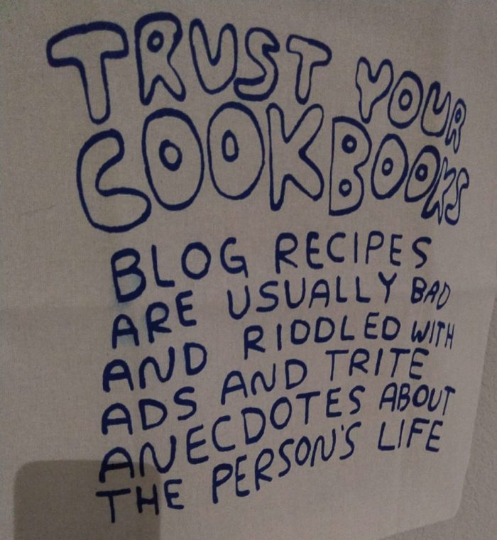 a tote bag with hand-written style letters that says "trust your cookbooks. blog recipes are usually bad and riddled with ads and trite anecdotes about the person's life"