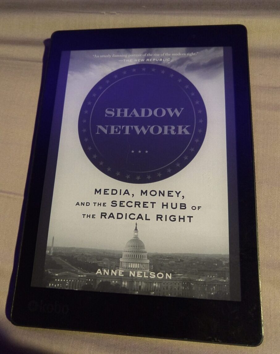 book cover of Shadow Network: Media, Money, and the Secret Hub of the Radical Right shown in greyscale on kobo ereader