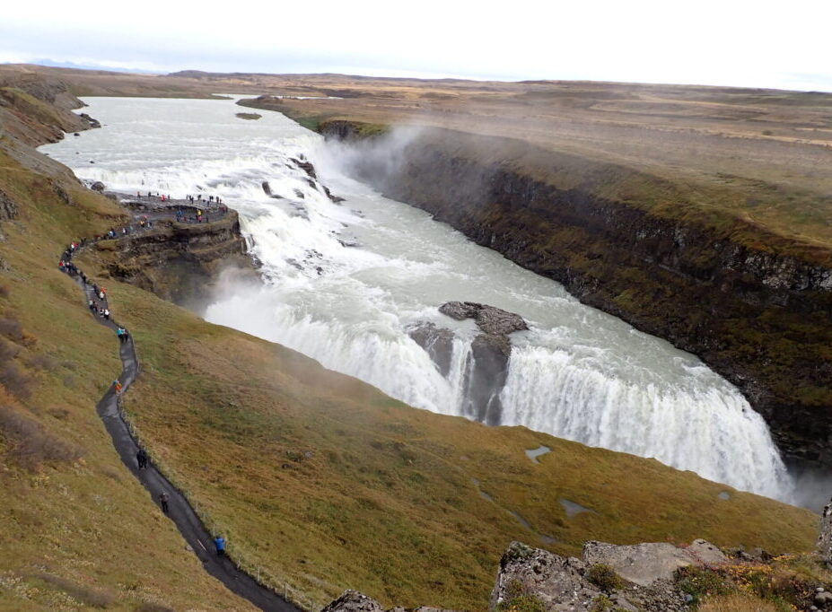 several layers of waterfalls that compose Gullfoss rushing through the canyon it as has created