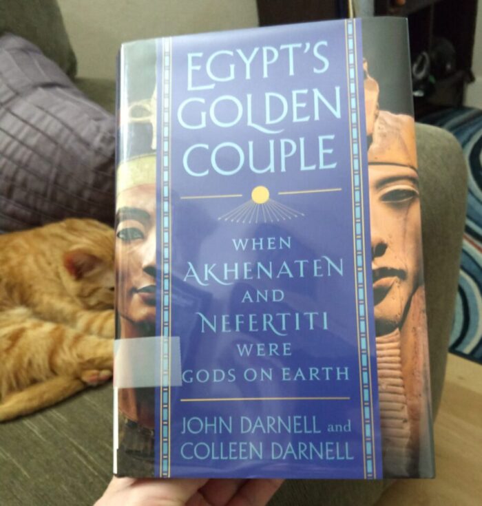 hardcover book: Egypt's Golden Couple. Fritz the cat is snoozing in the background