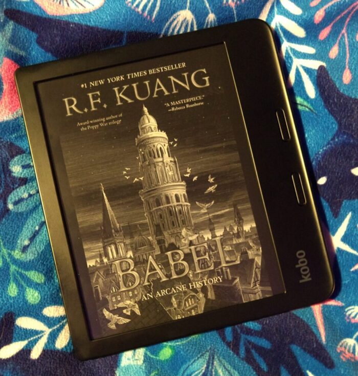 cover image for Babel: An Arcane History shown on kobo ereader. Cover features a tall tower standing out among smaller buildings