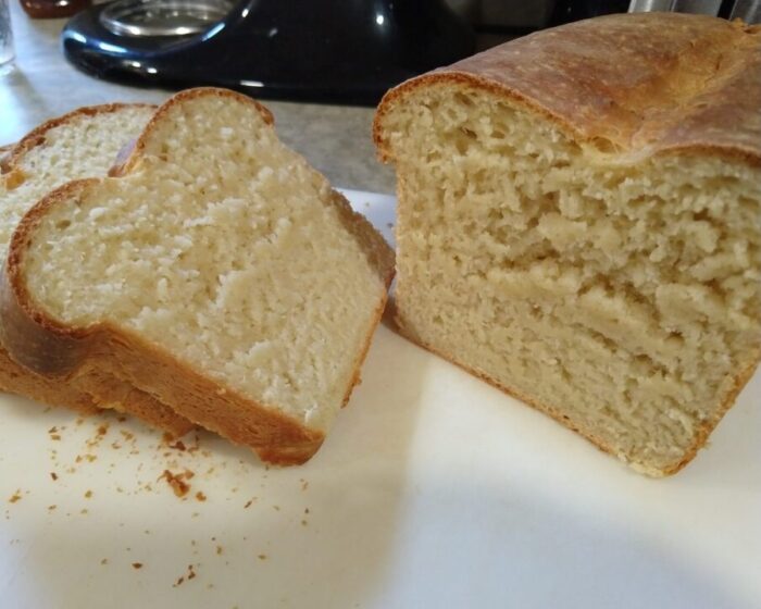 cross-section of a loaf of bread made with ricotta in the dough. I cut the loaf before it had cooled, so the crumb looks all smooshed.