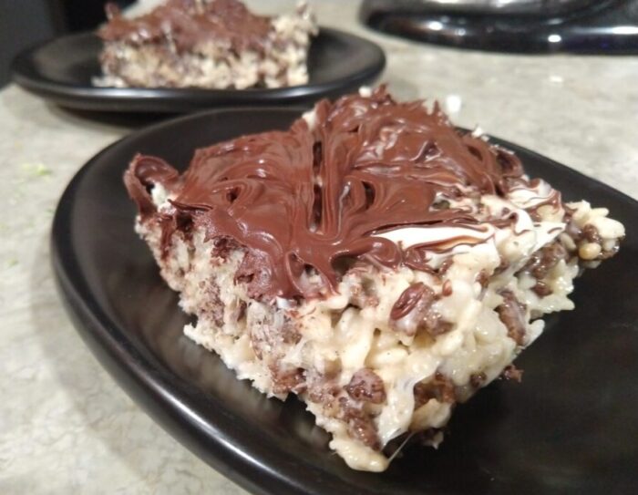 rice krispie treats made with a mix of regular and chocolate krispies, topped with chocolate