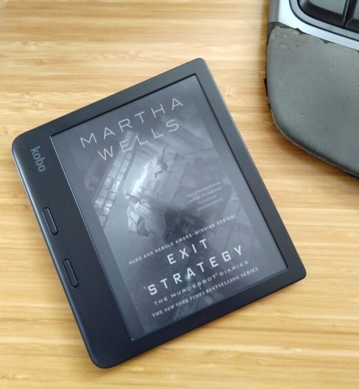 cover for Exit Strategy shown in greyscale on kobo ereader