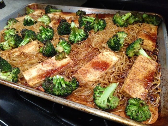 a one-pan meal of yaki soba, glazed tofu, and broccoli