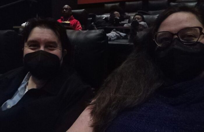 Kirk and I at the movie theater, smiling (or it seems like we're smiling behind our masks) at the camera