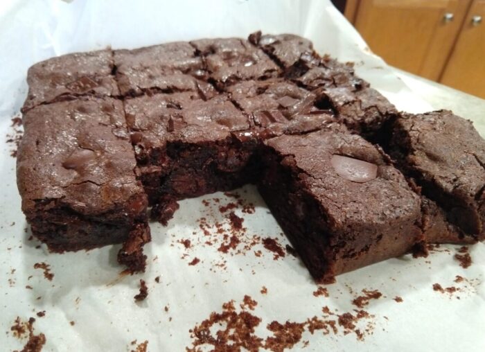 A close-up of a batch of brownies that have already been cut into