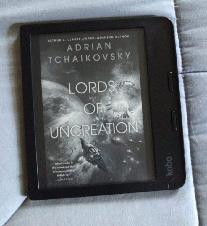 cover for Lords of Uncreation shown in greyscale on kobo ereader