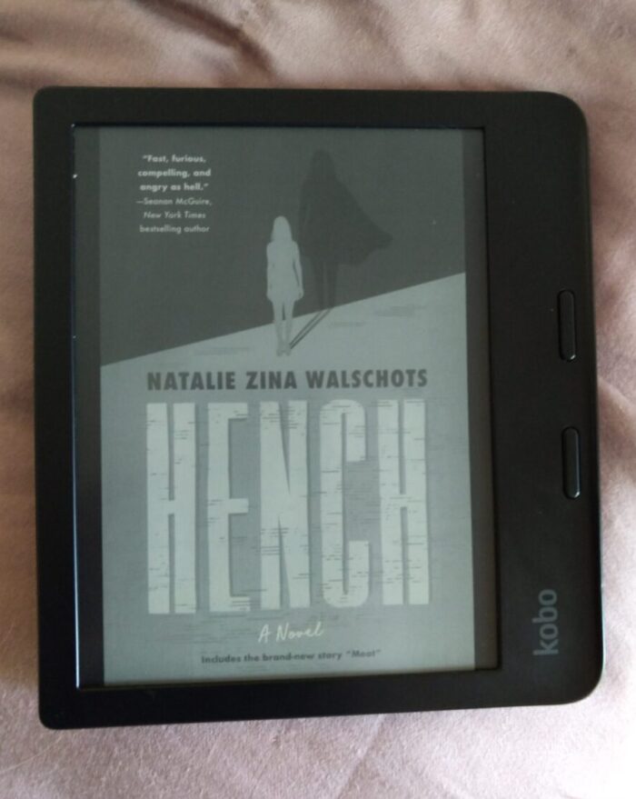 cover for the novel Hench shown in greyscale on kobo ereader