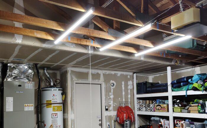 My now well-lit garage. Three long lights hang from the ceiling