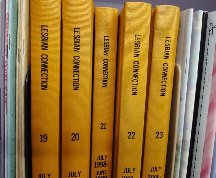 A shelf of bound periodicals with five volumes of "Lesbian Connection"