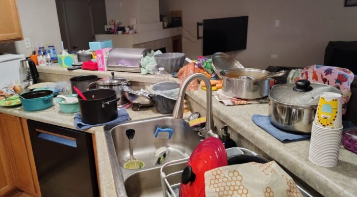 A bunch of pots of soup spread out across my kitchen counter