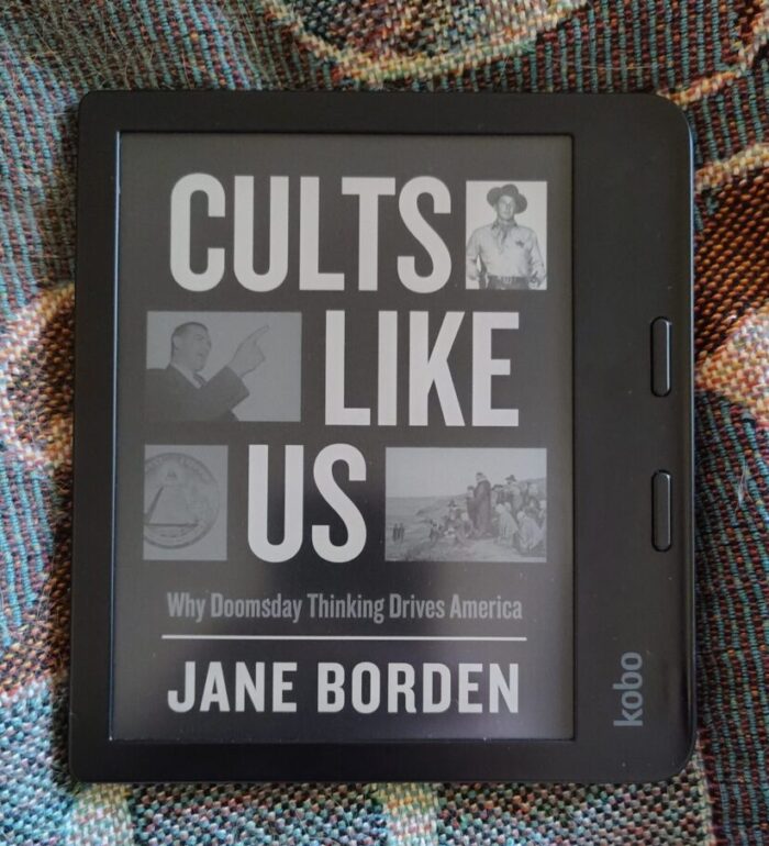 book cover of Cults Like Us shown in greyscale on kobo ereader
