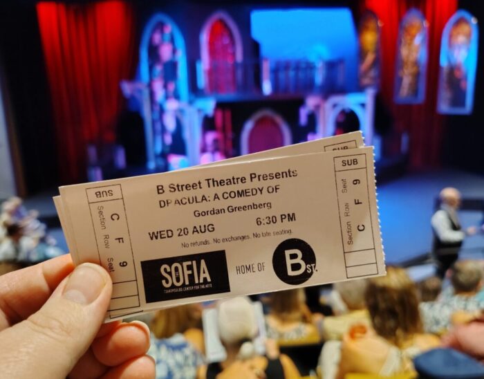 Tickets for the B Street Theater production of Dracula: A Comedy of Terrors held up in front of the stage before the show begins