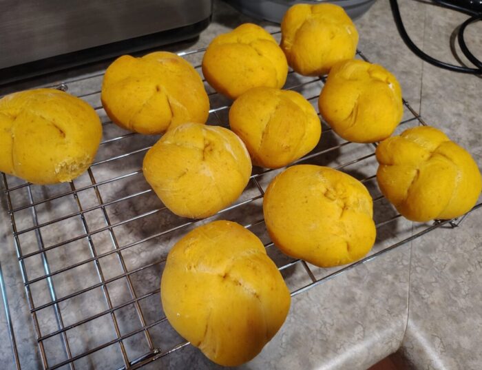 pumpkin knots with a nice warm orange color cooling on a wire rack