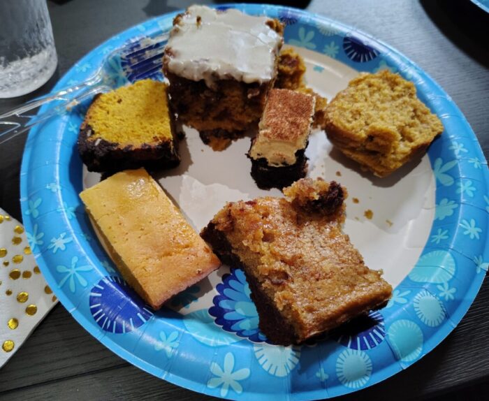 a plate with lots of bits of various desserts, most of them pumpkin themed