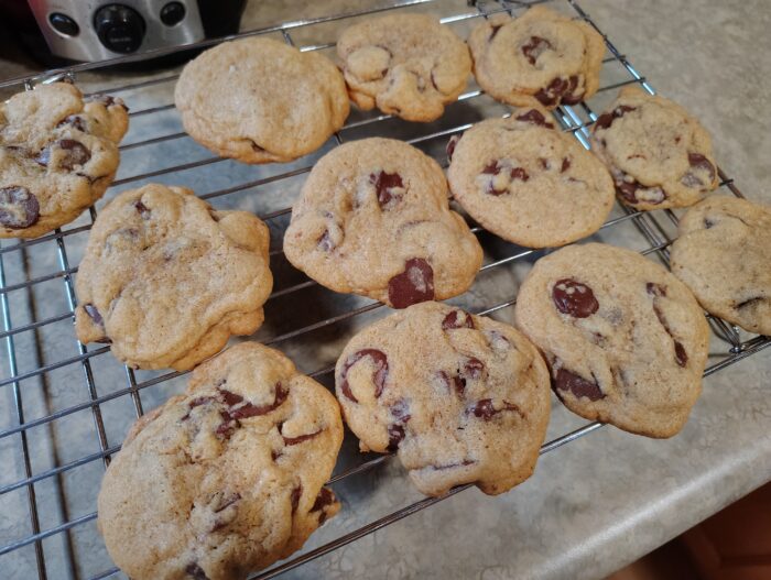 buckwheat chocolate chip cookies cooking on a wire rack