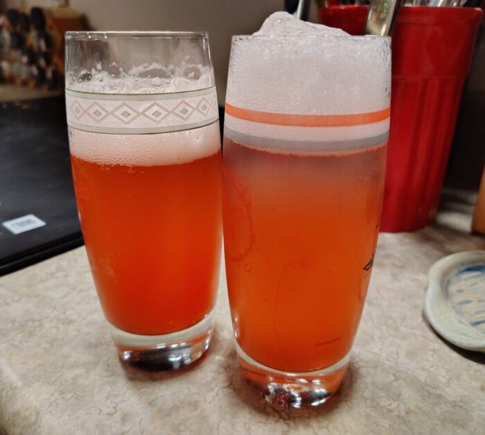 two glasses of homemade strawberry soda