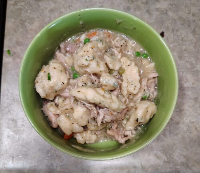 a bowl of chicken and dumpling soup