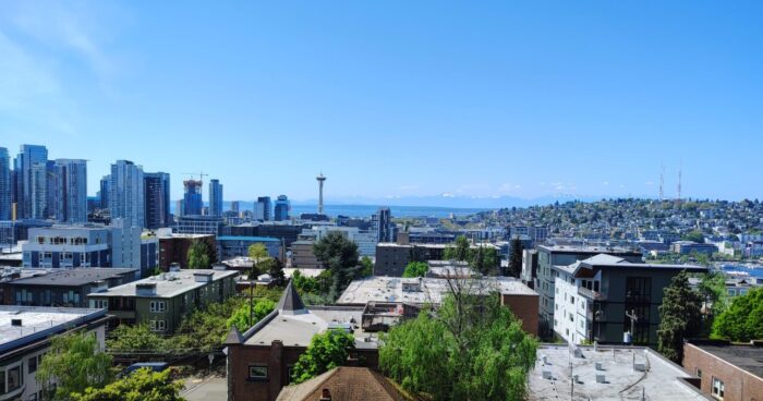 Seattle skyline on a clear day seen from my friend's apartment. The space needle and Lake Union are straight ahead and there are sky scrapers to the left.