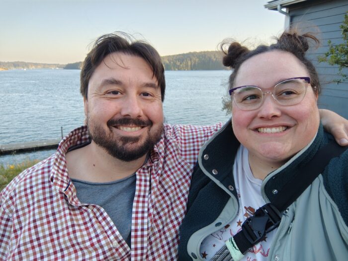 Kirk and I smiling for the camera with the Salish Sea in the background